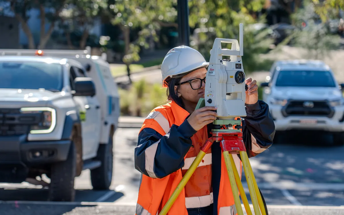 LCG surveyor operating a Leica total station
