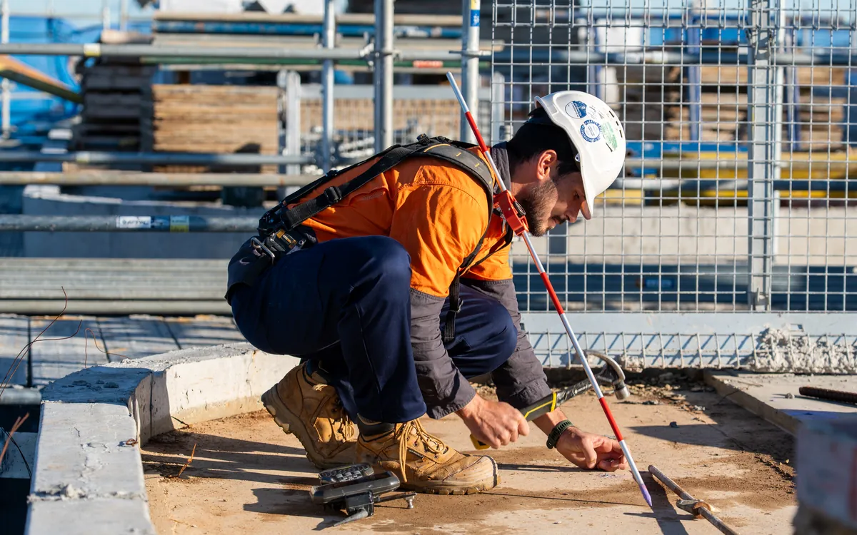 LCG surveyor marking a survey point on a construction site