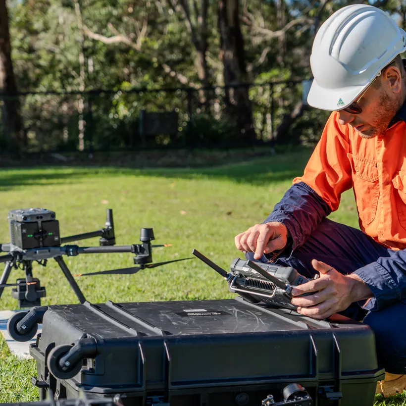LCG operator preparing a survey drone for launch