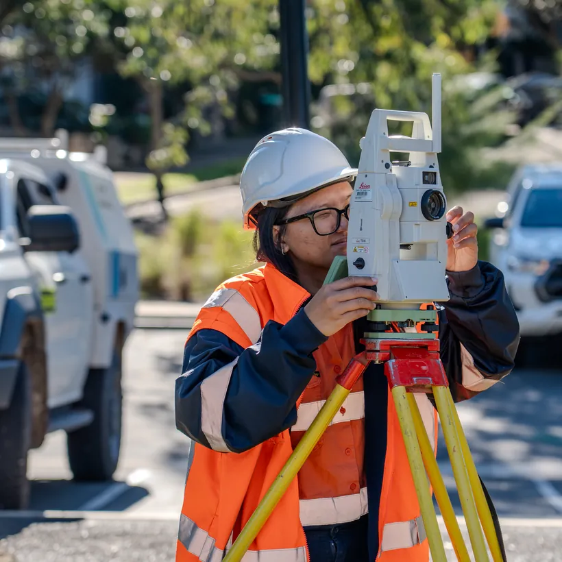 LCG surveyor operating a Leica total station