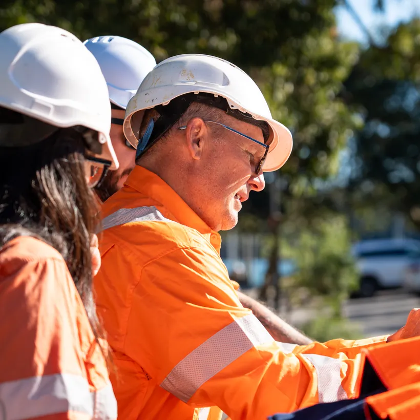 LCG team reviewing project plans on site